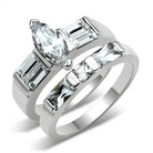 Stunning high polished silver engagement ring featuring a marquise diamond and emerald cut stones
