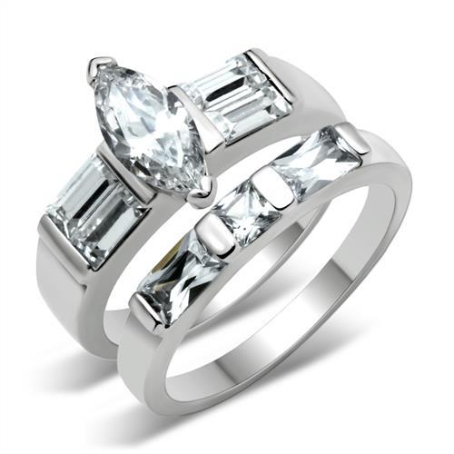 Stunning high polished silver engagement ring featuring a marquise diamond and emerald cut stones