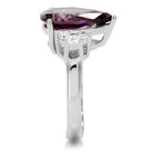 High polished stainless steel ring featuring a large purple gemstone and delicate side stones