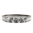 High polished stainless steel ring featuring four sparkling clear crystals for a stunning look