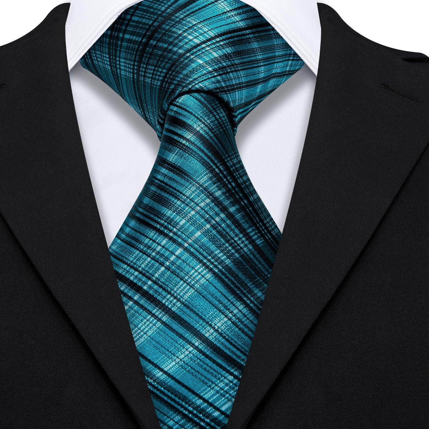 Stylish high quality teal tie with a modern plaid pattern perfect for formal occasions