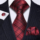 Stylish men's outfit featuring a high quality teal tie and a matching pocket square