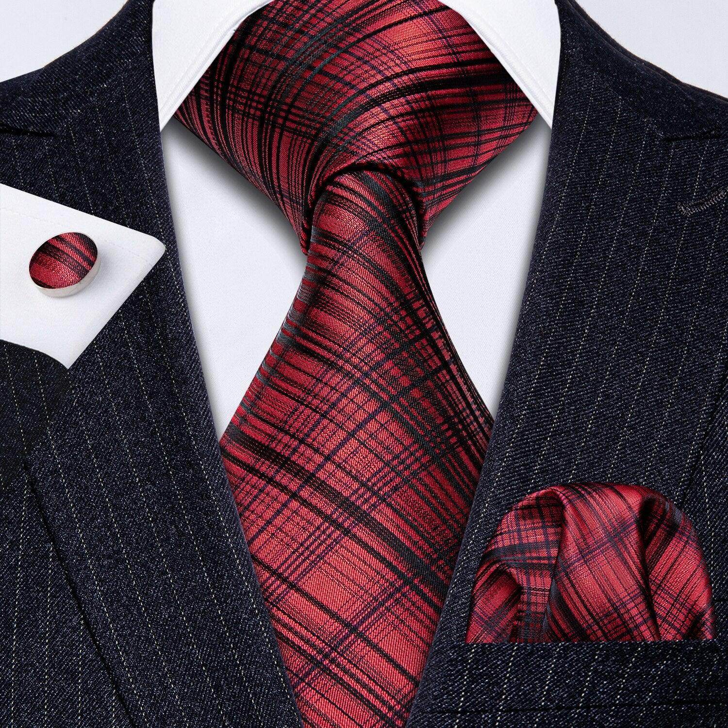 Stylish men's outfit featuring a high quality teal tie and a matching pocket square