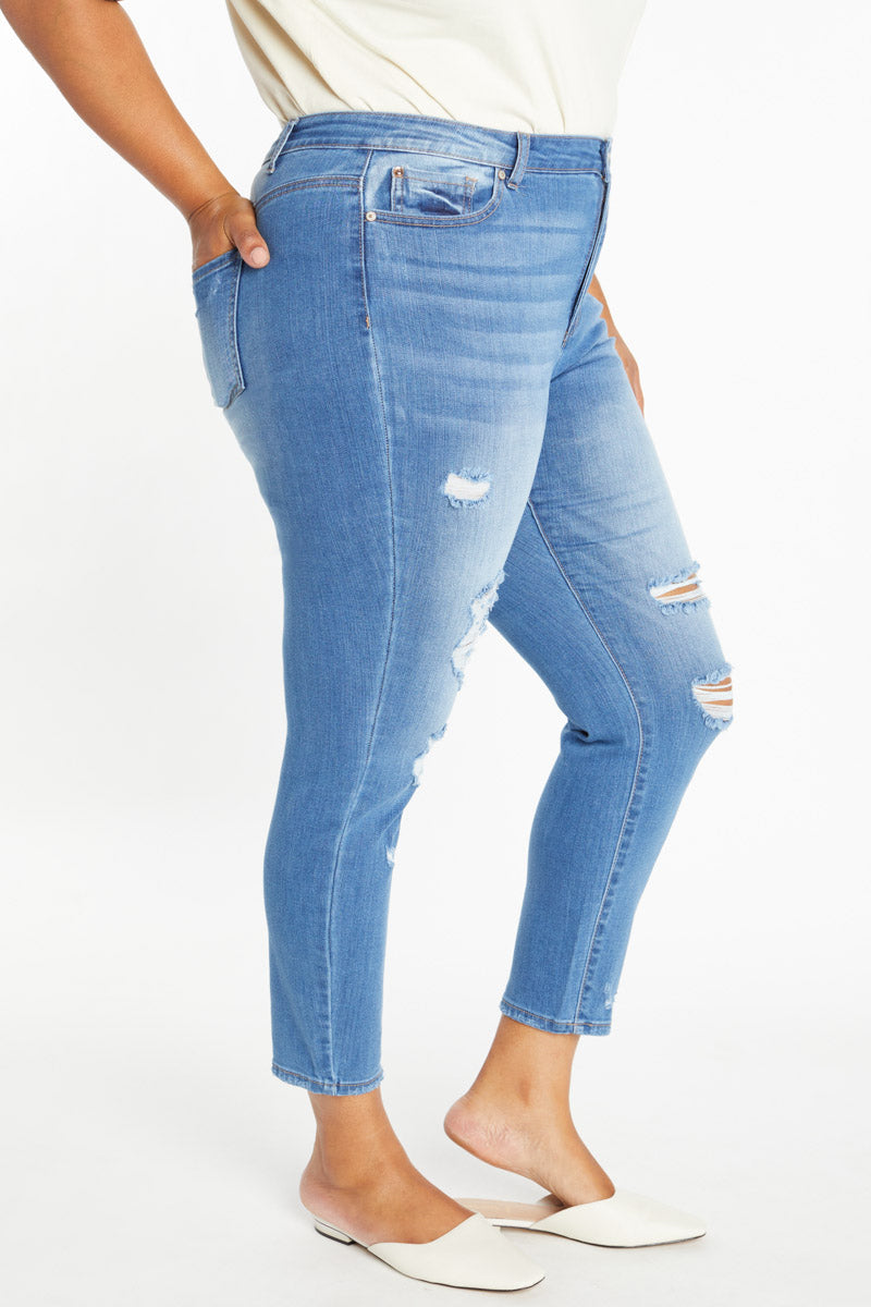 Women's high rise jeans in light blue, stylish distressed design