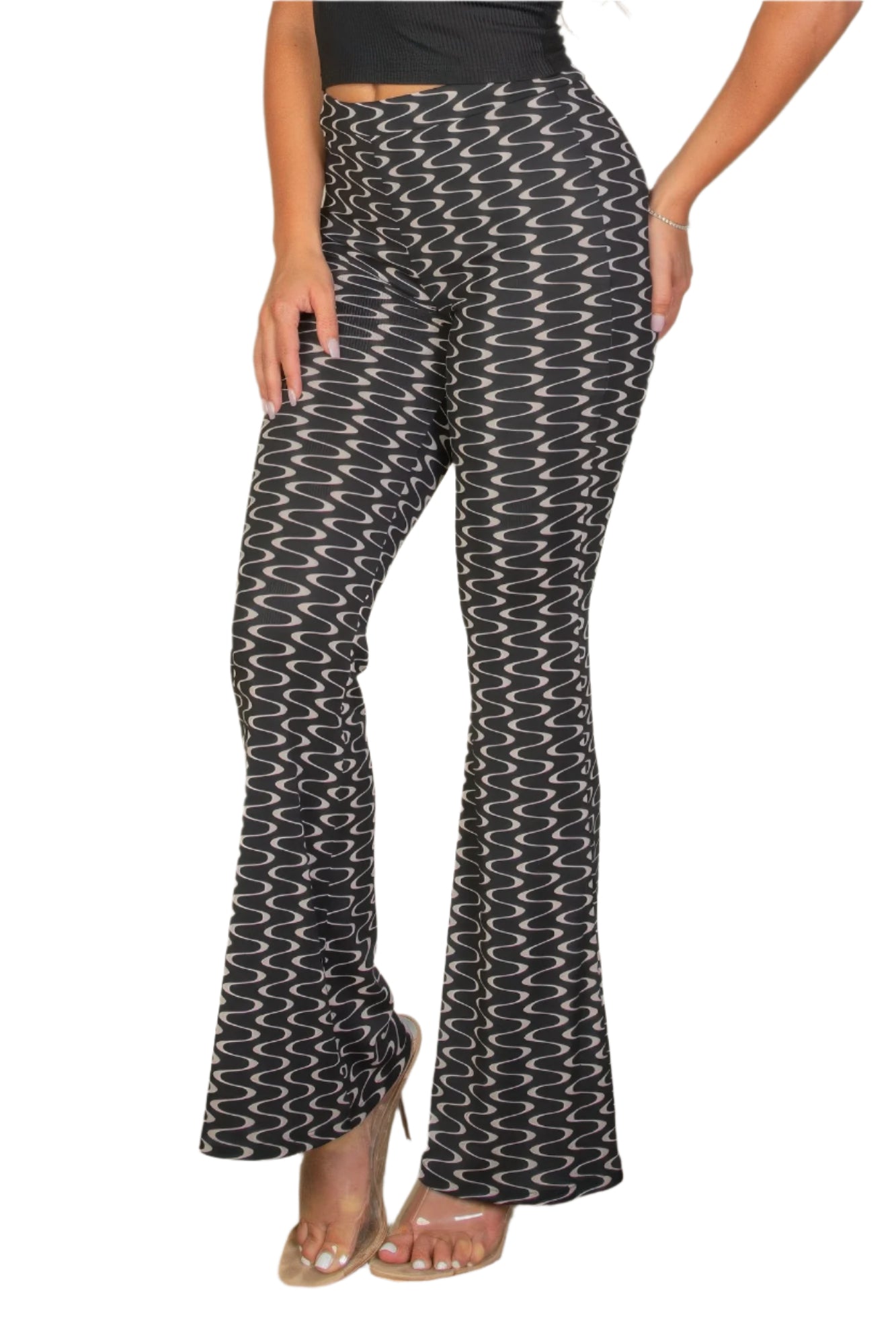 VacationGrabs black and white patterned high waist bell bottoms for women styled with clear heels