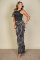 VacationGrabs high waist bell bottoms for women in black and white geometric pattern styled with a black crop top