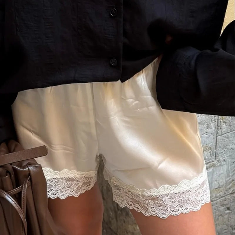 Women's high-waist shorts in cream satin, perfect for casual outings