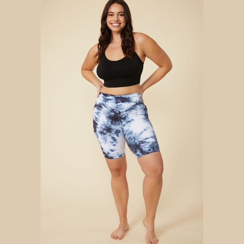 Woman wearing ALAMAE Apparel high waisted tie dye biker shorts in black and white with a black crop top