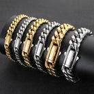 Collection of hip hop stainless steel bracelet for men in gold and silver finishes on a display stand