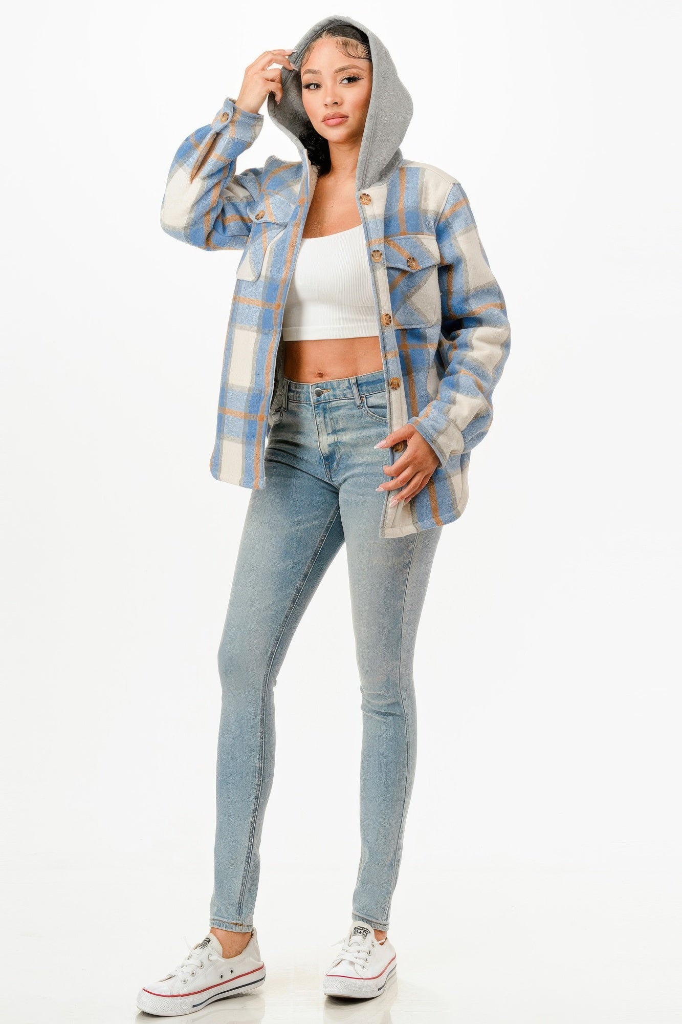 Hooded plaid jacket for women in blue and gray, paired with a white crop top and jeans