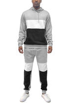 Men's hoodie sweatpants combo in grey and black with a stylish two-tone design by VacationGrabs