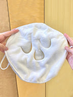 White hot compress face towel for soothing facial treatments