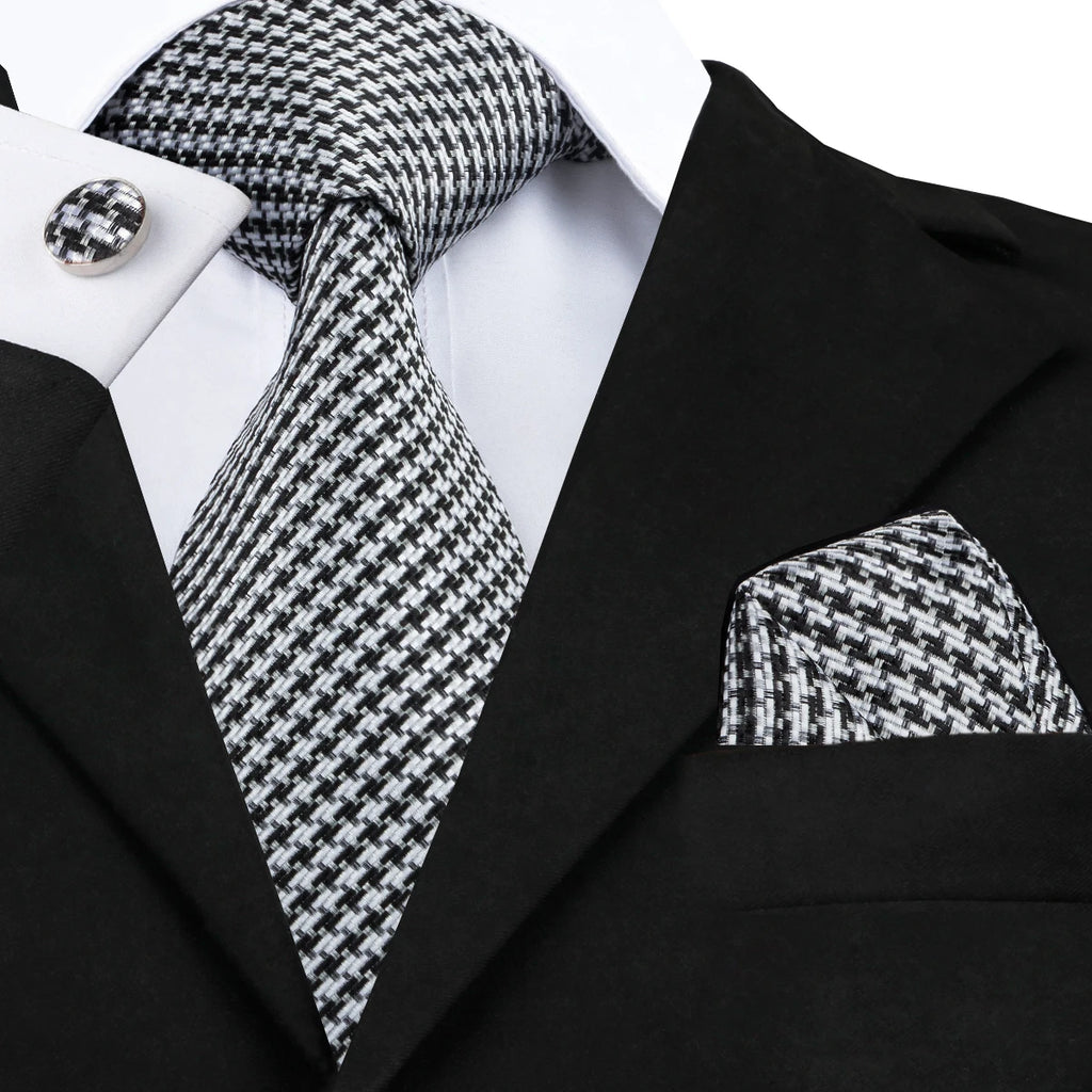 Black and white patterned men's tie for learning how to tie men's tie