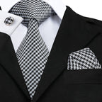 Black and white patterned men's tie for learning how to tie men's tie