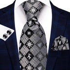 Men's black and silver patterned tie, perfect for formal events, how to tie men's tie