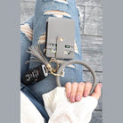 Gray ID holder keychain bracelet with a wallet and car keys for stylish accessory organization