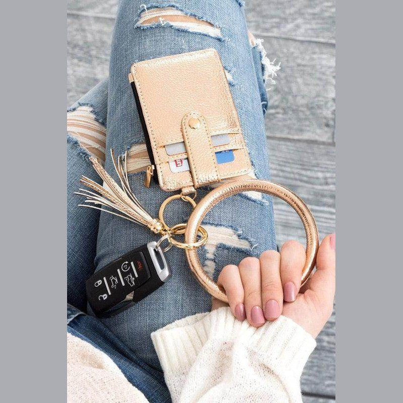 Aili's Corner ID holder keychain bracelet with a stylish gold finish and tassel attached