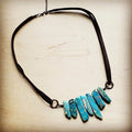 Unique imperial jasper slab necklace with turquoise tones on a black cord for stylish accessorizing