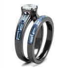 Stunning IP gun color engagement ring featuring a sparkling center stone and blue accent stones