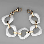 Stylish IP rose gold chain bracelet with white resin links for a chic look