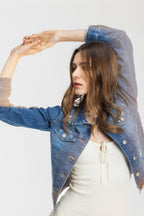 Women's denim jacket in classic blue, perfect for casual outings