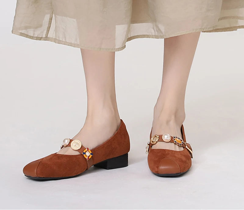 Jane Mary shoes in brown suede with decorative buttons, perfect for stylish occasions