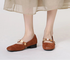 Jane Mary shoes in brown suede with decorative buttons, perfect for stylish occasions