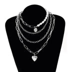 Stylish jester necklace for women featuring layers of pearls and silver chains