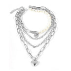 ClaudiaG Collection jester necklace for women featuring multiple silver chains and a heart pendant
