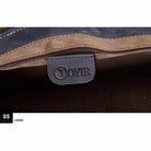 Close-up of the interior zipper of a vintage leather mens briefcase by VacationGrabs