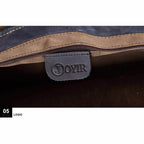 Close-up of the interior zipper of a vintage leather mens briefcase by VacationGrabs