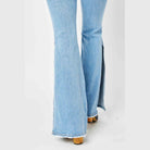 Judy Blue mid rise flare jeans in light blue denim with stylish side slits for a trendy look