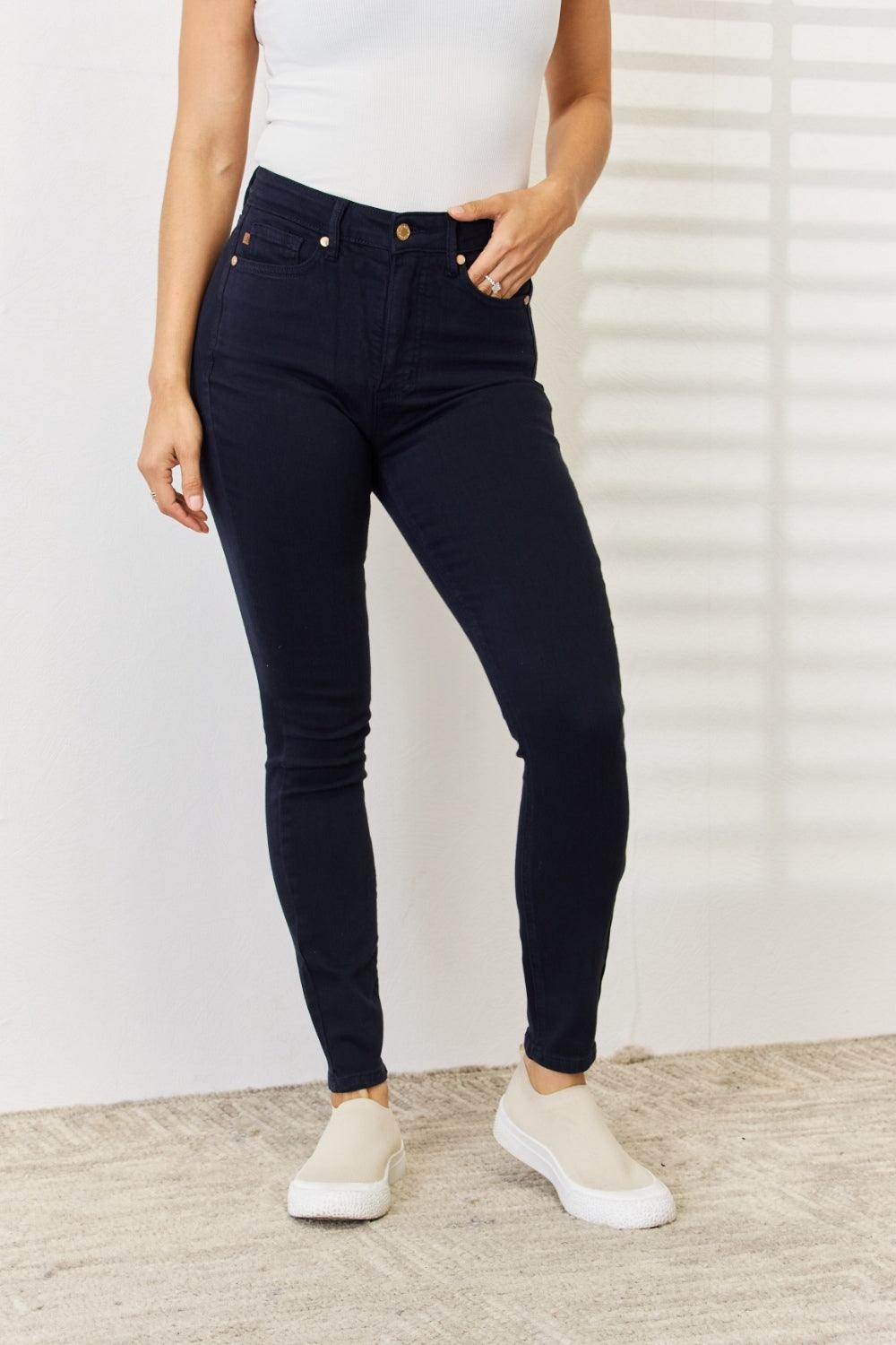Trendsi Judy Blue tummy control skinny jeans in dark wash, designed for a flattering fit and comfort.