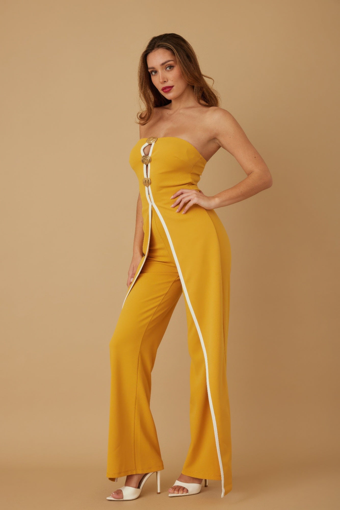 Stylish strapless jumpsuit for women in yellow with a side slit and decorative front zipper