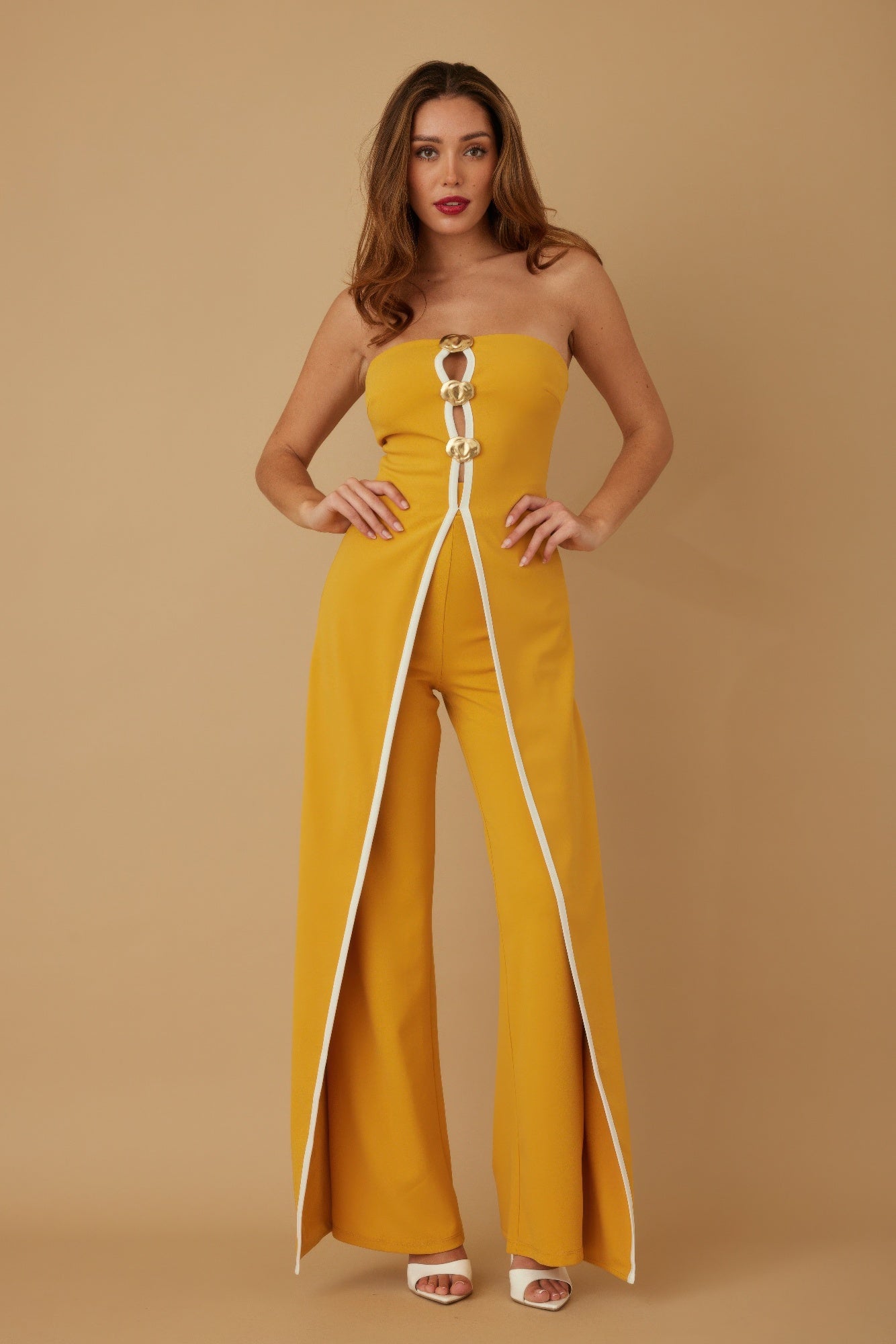 Stylish strapless jumpsuit for women in vibrant yellow with a chic front zipper design