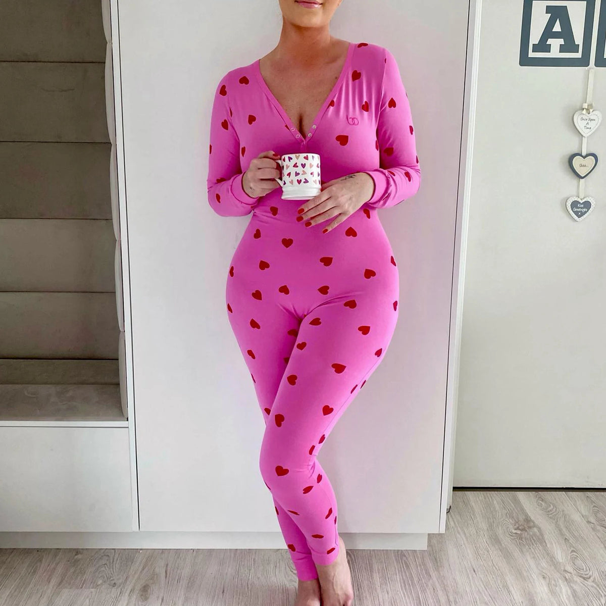 Pink jumpsuits women with heart pattern, perfect for lounging at home