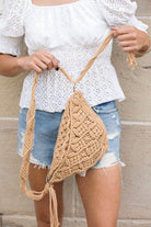 Khaki sling bag vacation with intricate macrame design, perfect for stylish outings