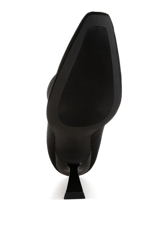 Sole view of Kintley heeled ankle boots showcasing sleek design and durable material