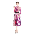 By Claude knee-length dress for travel with a vibrant floral pattern and pleated style