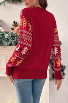 Stylish knit Christmas sweater for women in red with colorful festive patterned sleeves