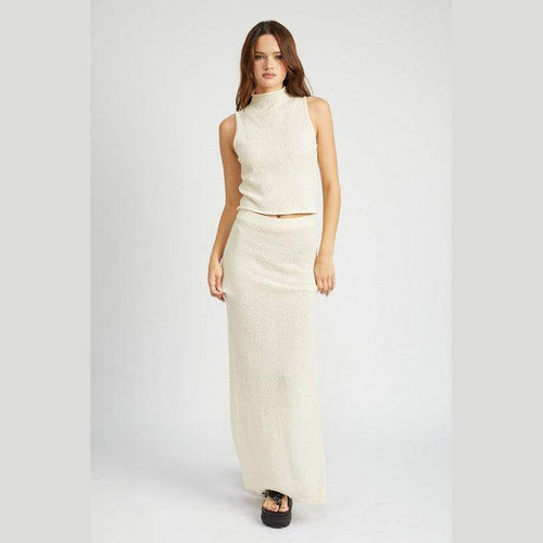 Emory Park knit sleeveless blouse in light cream paired with a matching long skirt for a stylish summer look