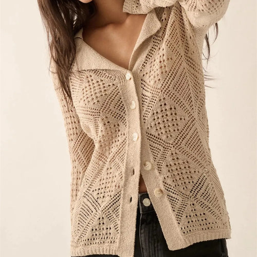 Women's beige knitted cable sweater, perfect for cool weather styling