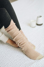 Leto Accessories knitted lounge socks in soft beige color, perfect for cozy indoor wear
