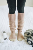 Cozy knitted lounge socks for women in soft pink color, perfect for lounging at home