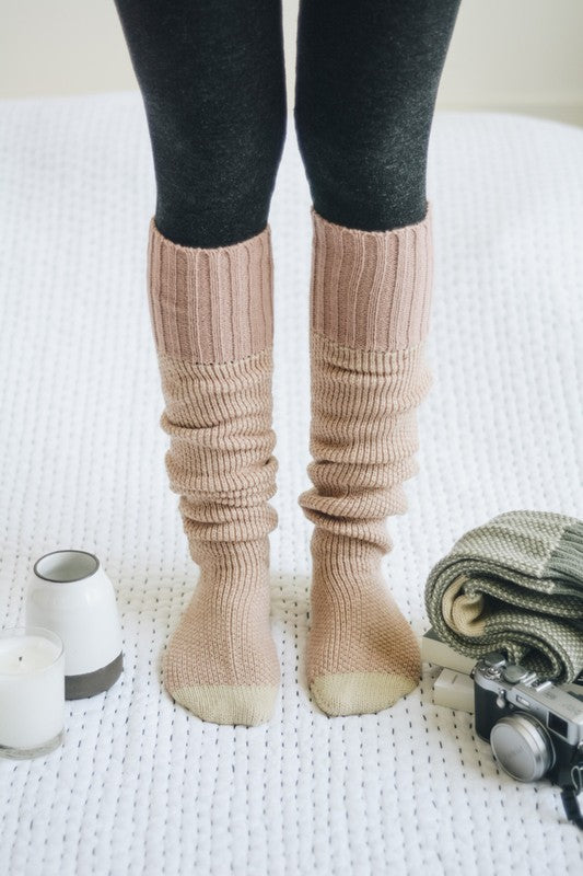 Cozy knitted lounge socks for women in soft pink color, perfect for lounging at home