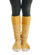 Cozy yellow knitted lounge socks for women, perfect for relaxation and comfort at home