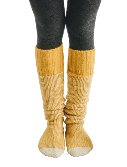 Cozy yellow knitted lounge socks for women, perfect for relaxation and comfort at home