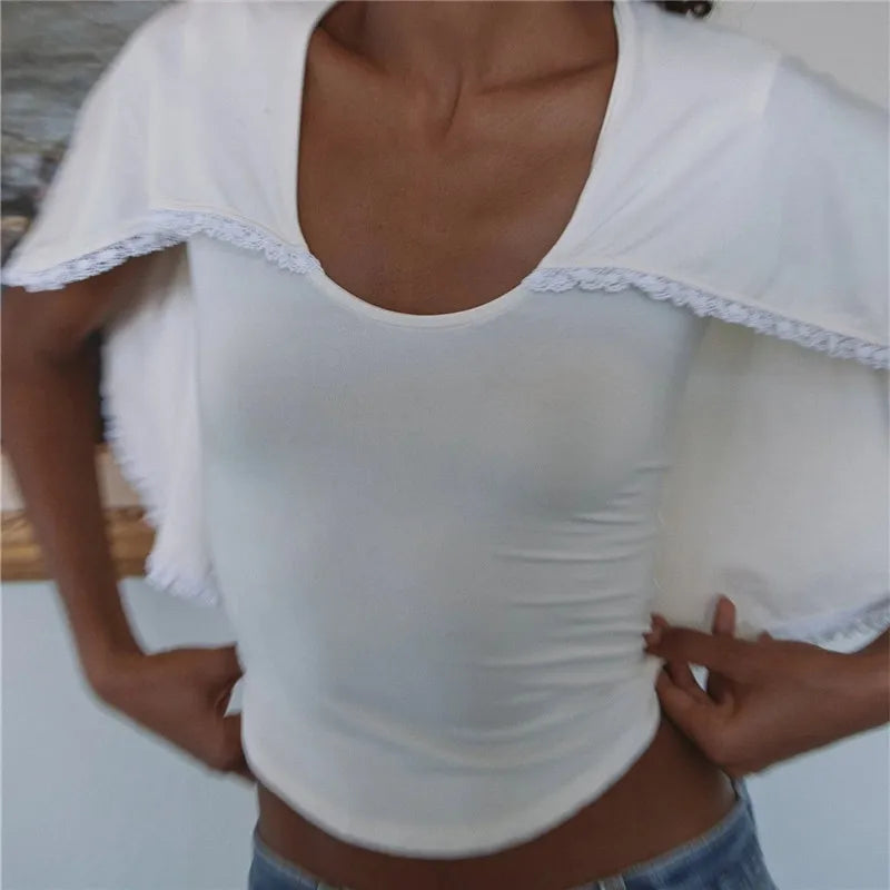 White top with lace and trim detail, perfect for casual outings