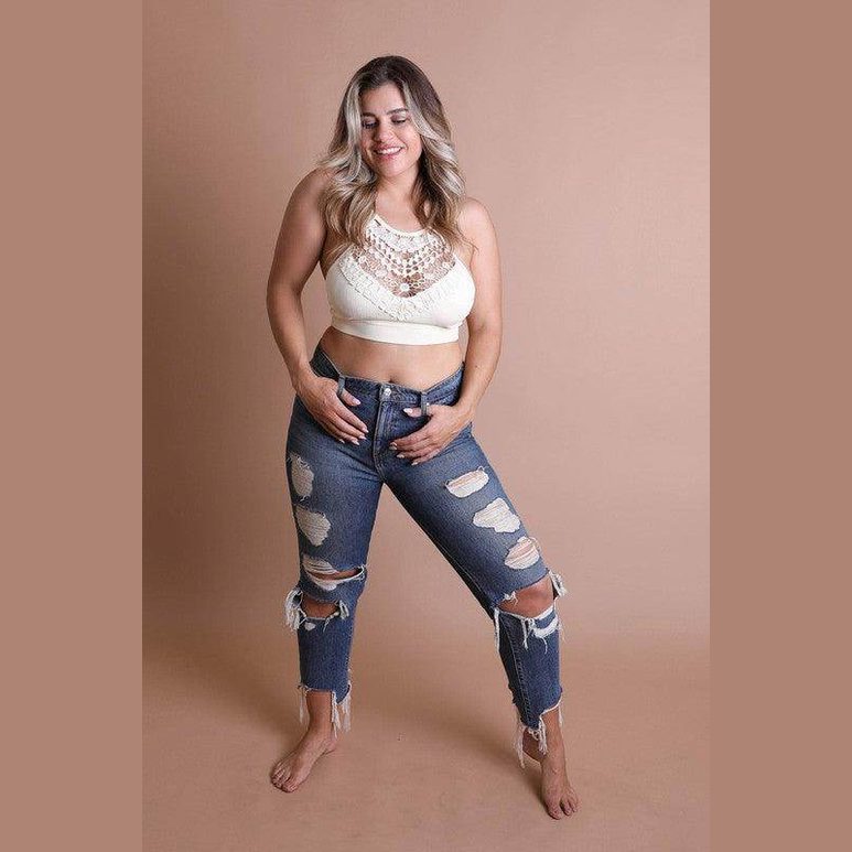 Stylish lace high neck top women paired with distressed jeans for a trendy summer look