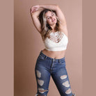 Stylish lace high neck top women paired with distressed jeans for a fashionable look